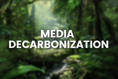 Blurry forest background with the words "MEDIA DECARBONIZATION" in white text overlay.