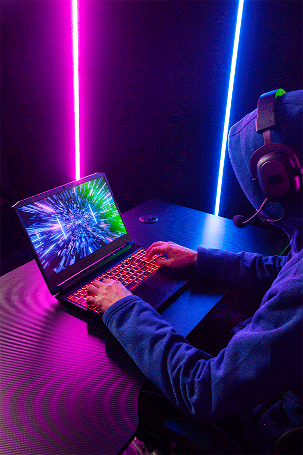 side-view-gamer-playing-laptop